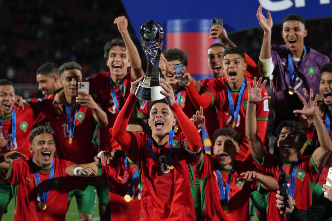 Morocco players celebrate with the trophy after defeating Argentina in the FIFA U-20 World Cup final match in Santiago, Oct. 19, 2025. (AP)