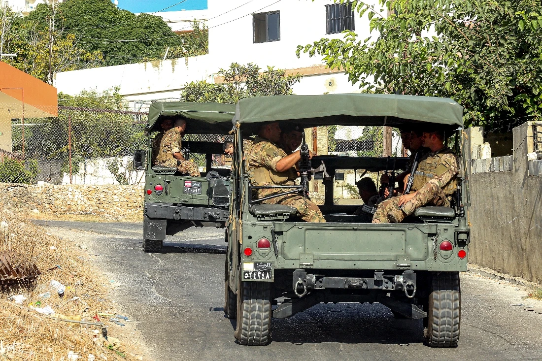 Lebanese army vehicles move along a road near the Ain al-Hilweh camp for Palestinian refugees in Lebanon's southern city of Sidon . (AFP)