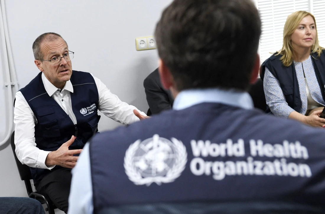 Hans Kluge, the World Health Organization (WHO) Regional Director for Europe, talks to his WHO colleagues as he visits victims of a fuel depot blast who are being treated at the National Burn Center in Yerevan, Armenia. (AFP)
