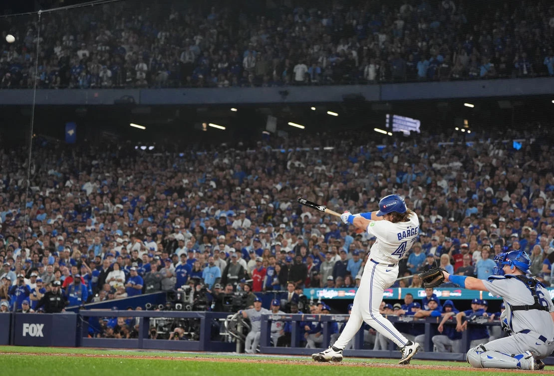 Toronto Blue Jays’ Addison Barger hits a grand slam against the Los Angeles Dodgers during the sixth inning of Game One of baseball’s World Series in Toronto on Oct. 24, 2025. (The Canadian Press via AP)