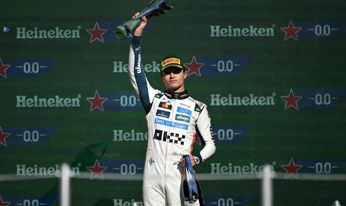 McLaren's British driver Lando Norris lifts the trophy on the podium after winning the Mexico City Formula One Grand Prix at the Hermanos Rodriguez racetrack in Mexico City on October 26, 2025. (AFP)