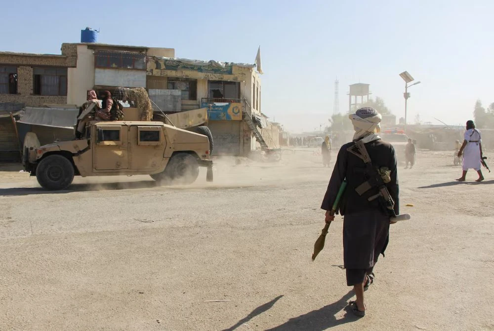 Taliban fighters patrol near the Afghanistan-Pakistan border in Spin Boldak, Kandahar Province, following exchanges of fire between Pakistani and Afghan forces, Oct. 15, 2025. (Reuters)