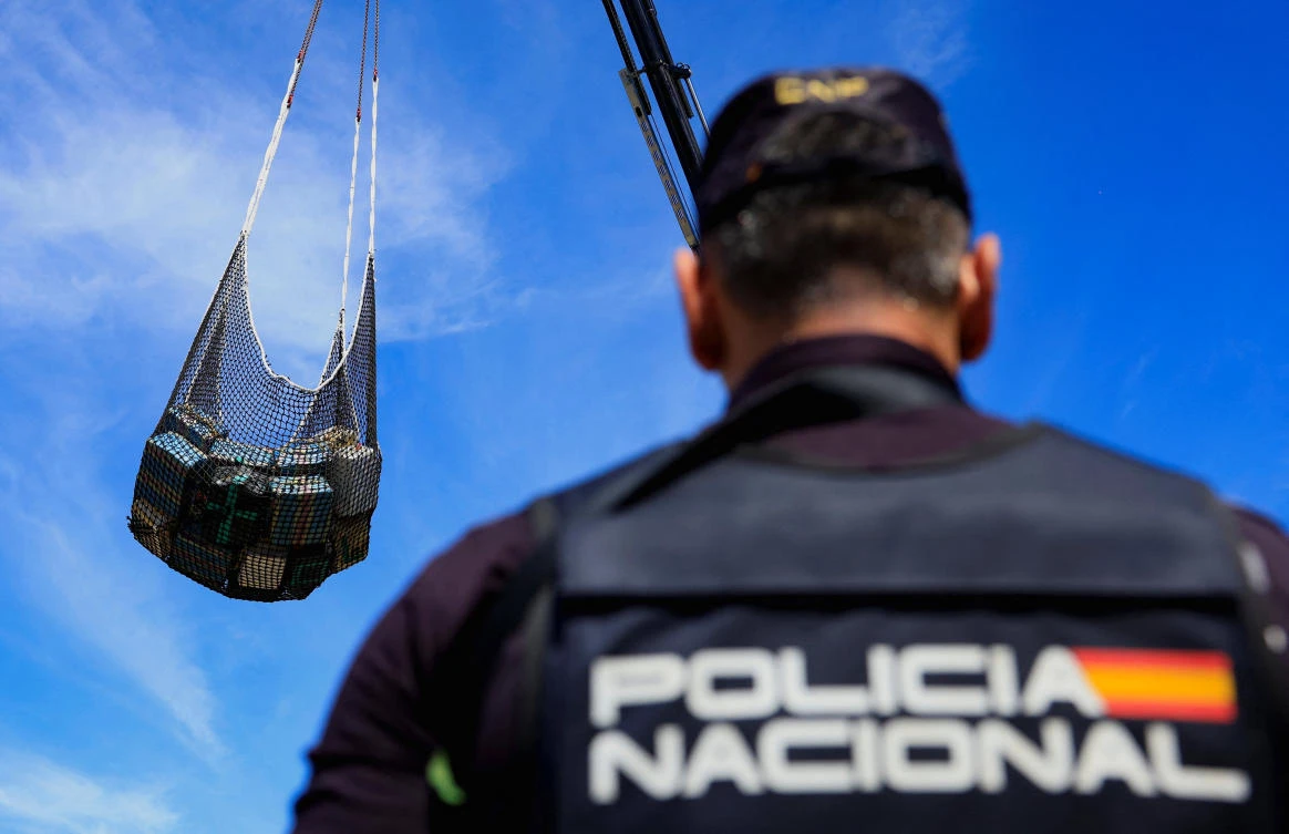 A Spanish National Police officer observes the unloading of drugs at the Port of Arinaga, on the island of Gran Canaria, Spain, Oct. 26, 2025. (Reuters)