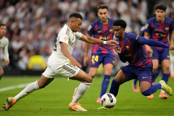 Real Madrid will look to take care of business against a struggling Valencia and maintain their La Liga lead this weekend before turning to their demanding match at Liverpool. (AP/File)