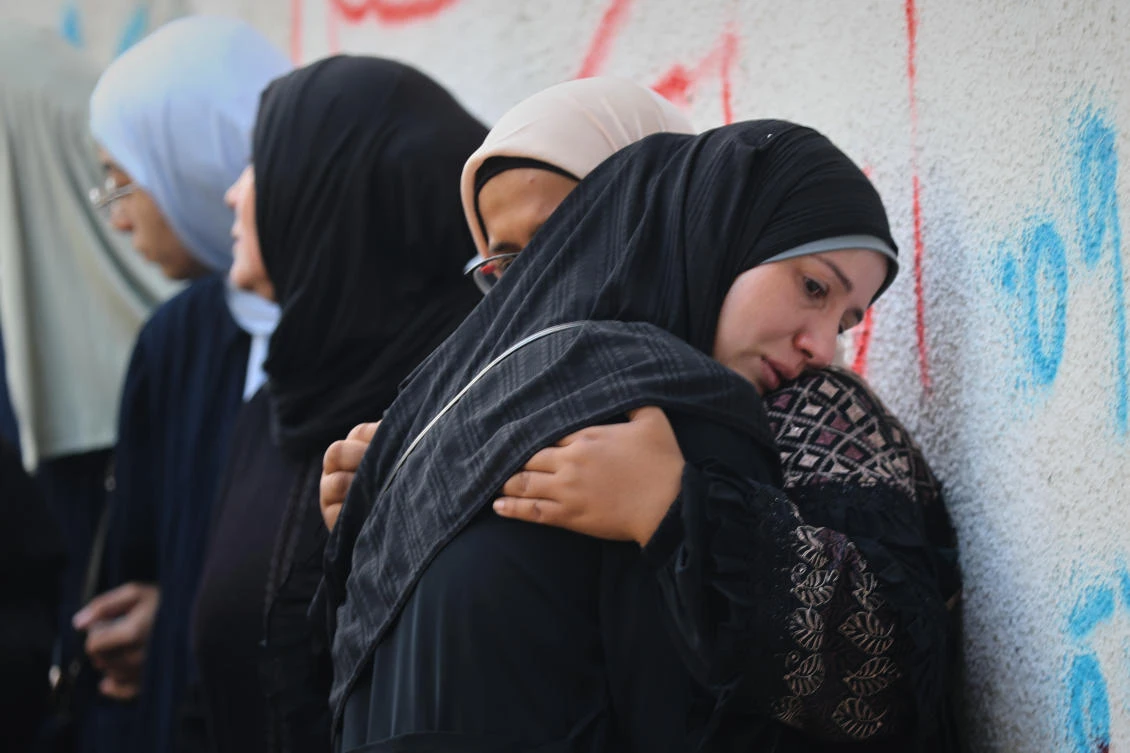 Above, Palestinian women mourn their relatives killed in an Israeli army strike on Oct. 29, 2025. (AP)