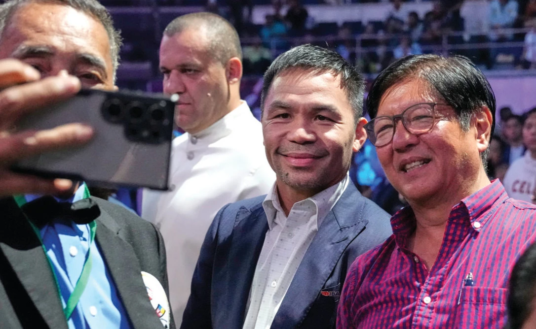 Philippine President Ferdinand Marcos Jr., right, poses with Filipino boxing hero Manny Pacquiao, on Oct. 30, 2025, Wednesday in Quezon City during boxing matches to celebrate the 50th anniversary of the iconic ‘Thrilla in Manila’ fight. (AP)