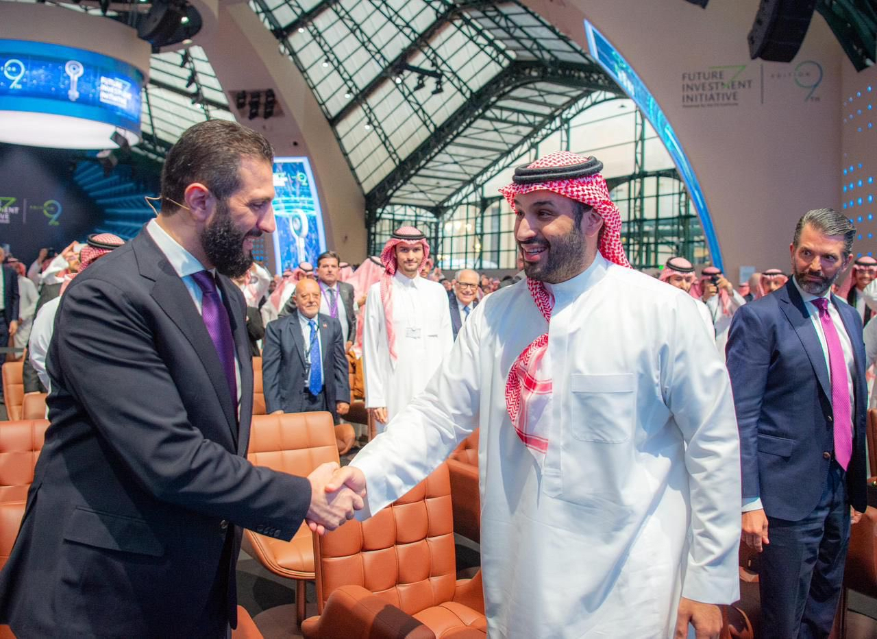 Saudi Crown Prince Mohammed bin Salman shakes hands with Syrian President Ahmad Al-Sharaa at the FII in Riyadh on Wednesday.