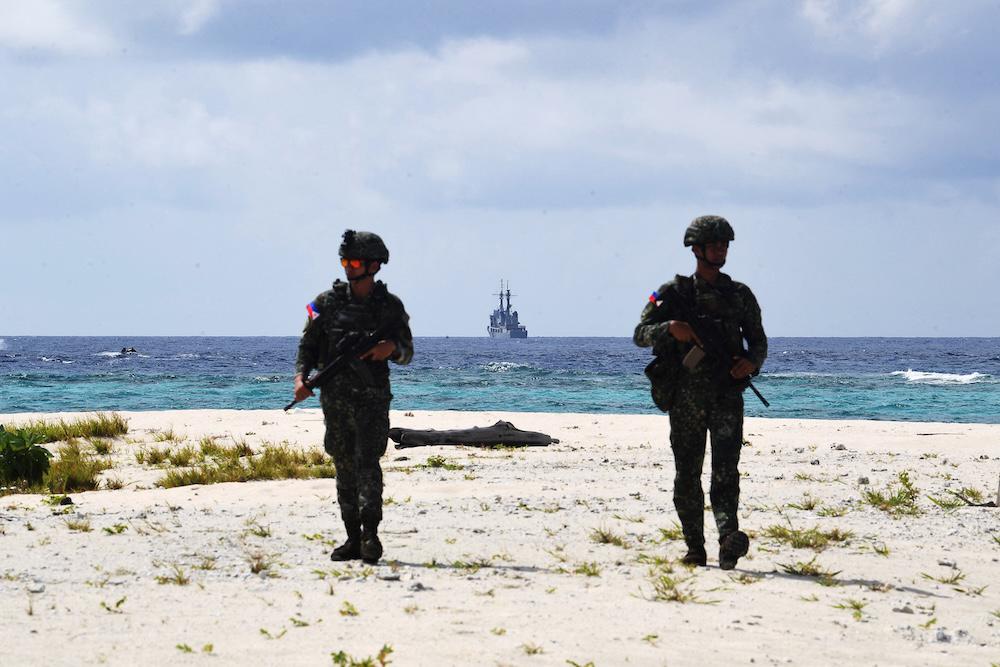 Philippine marines patrol the shores of West York Island, one of the islands occupied by the Philippines in the disputed South China Sea, on June 5, 2025. (AFP)