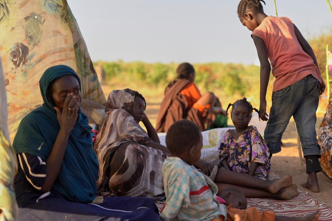 Above, displaced children and families from El-Fasher at a camp where they sought refuge from fighting between government forces and the RSF, in Tawila, Darfur region. (UNICEF via AP)
