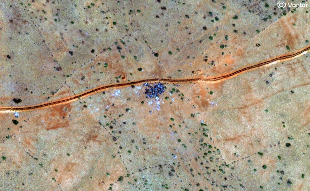 This handout satellite image by Vantor taken on October 30, 2025 and made available on October 31, 2025 shows a general view of burnt vehicles along the berm northwest of El-Fasher. (AFP)