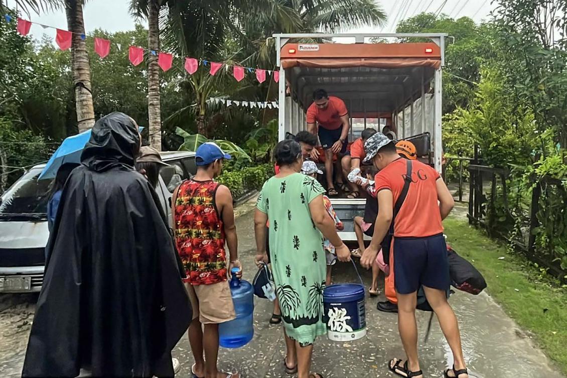 Philippine coast guard personnel assist in evacuating residents in Guiuan town, Eastern Samar province ahead of the landfall of Typhoon Kalmaegi on Nov. 3, 2025. (Philippine Coast Guard/AFP)