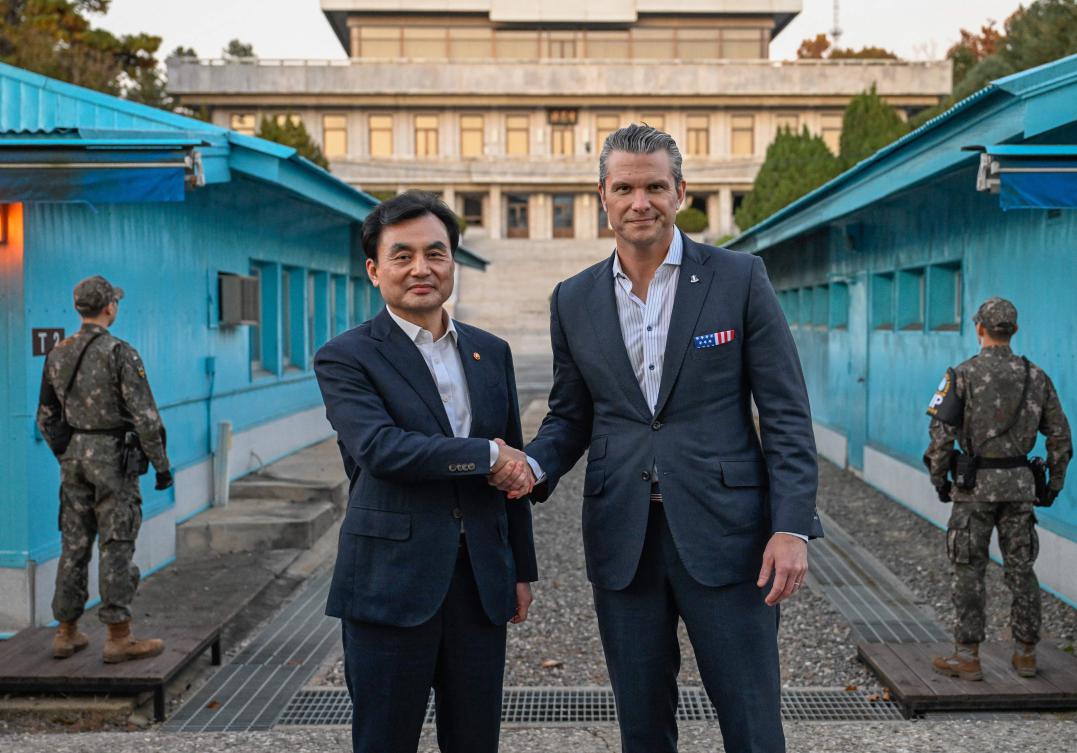 US Defense Secretary Pete Hegseth, right, shakes hands with his South Korean counterpart Ahn Gyu-back as they visit the truce village of Panmunjom in the Demilitarized Zone on Nov. 3, 2025. (South Korean Defense Ministry/AFP)