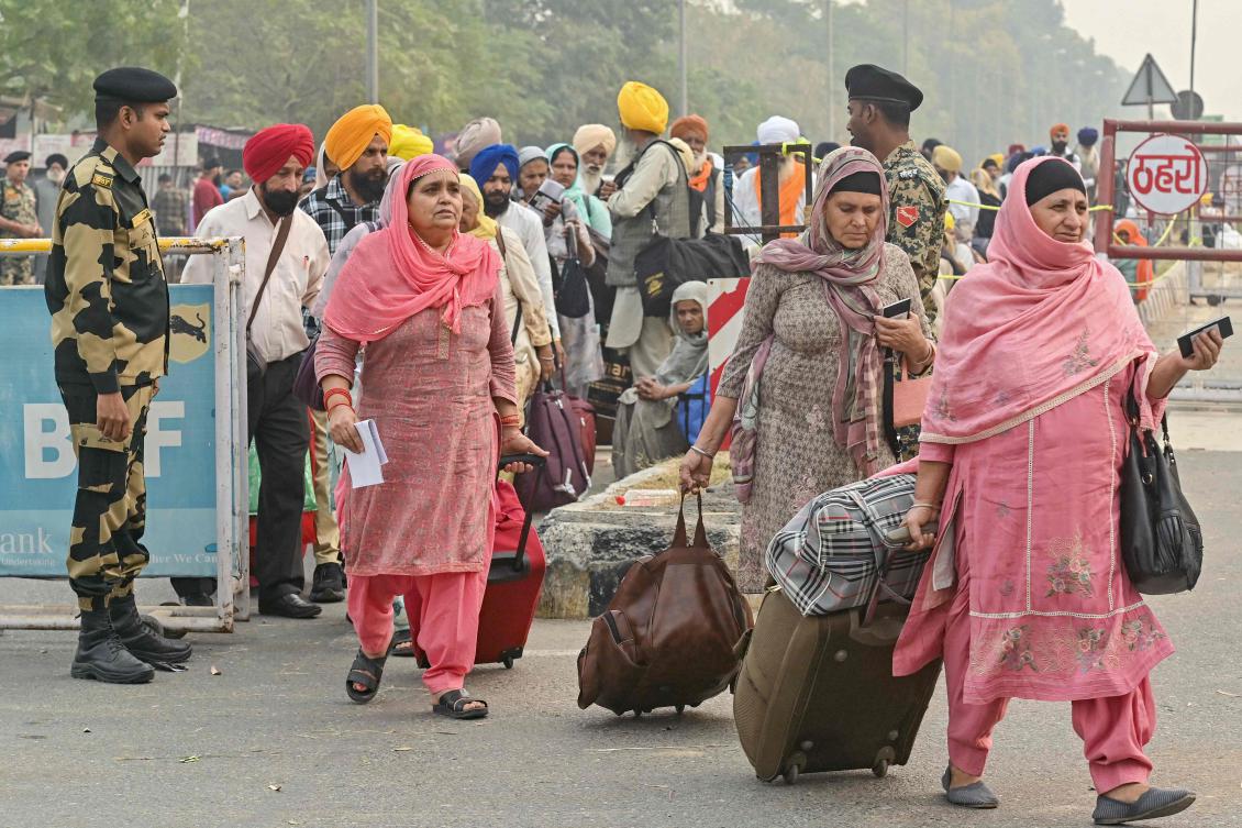 Indian Border Security Force personnel stand guard as Indian Sikh pilgrims head to Pakistan at the India-Pakistan Wagah border in Wagah on Nov. 4, 2025. (AFP)