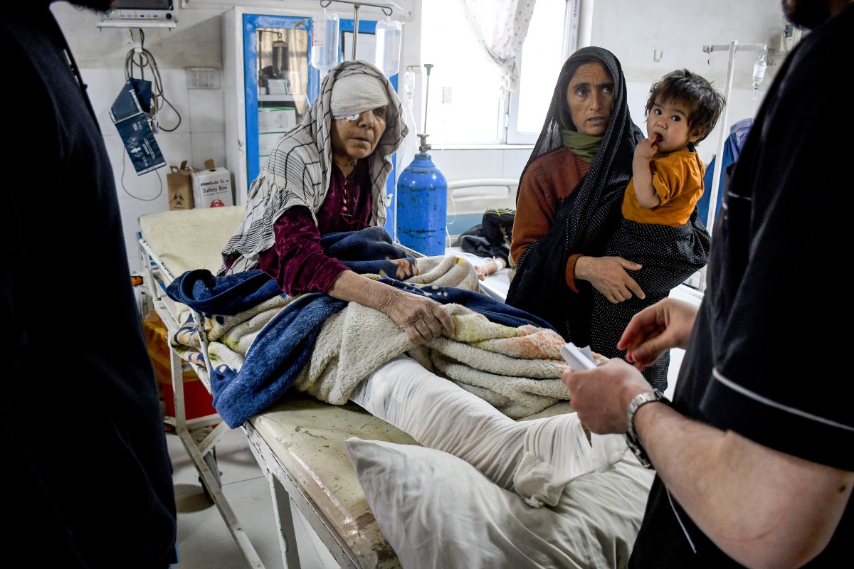 An injured Afghan woman receives treatment at a hospital in the aftermath of an earthquake, that struck overnight in Mazar-i-Sharif on Nov. 3, 2025. (AFP/File)