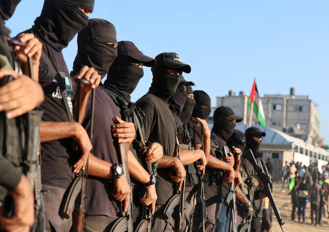Hamas fighters holed up in the Israeli-held Rafah area of Gaza would surrender their arms in exchange for passage to other areas of the enclave under a proposal to resolve an issue seen as a risk to the month-old truce, according to two sources familiar with the talks. (Reuters/File)