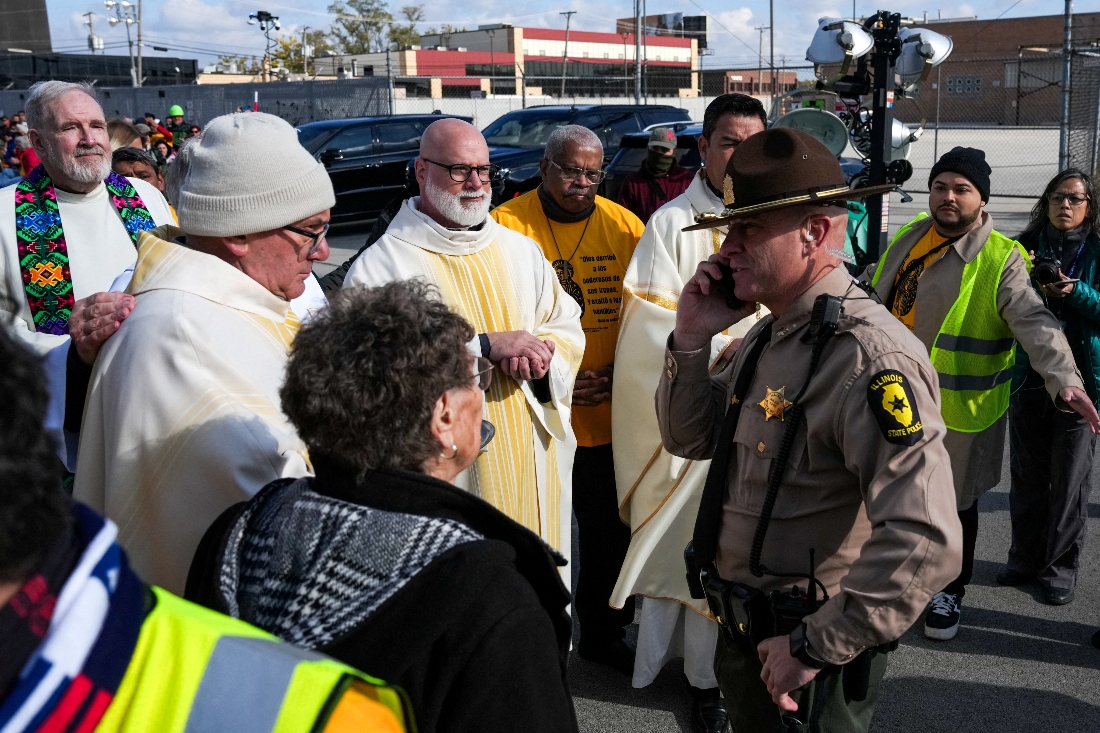Law enforcement officers prevent religious leaders from entering the Broadview ICE facility and offering communion to immigrants detained inside, during a Catholic Mass, led by Bishop Jose Maria Garcia Maldonado in Illinois, US. (Reuters)