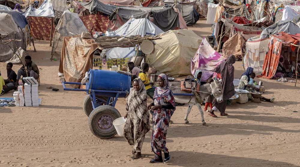 Displaced Sudanese in the Um Yanqur camp in the western Darfur region after fleeing El-Fasher. (AFP/File Photo)