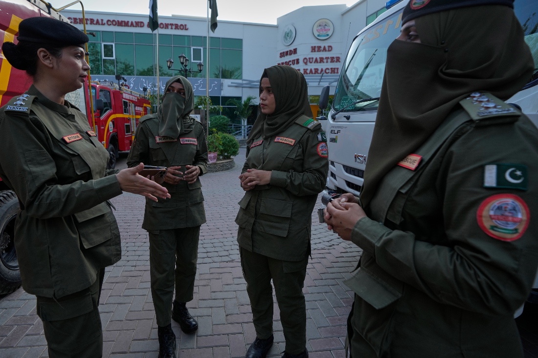 Female firefighter Syeda Masooma Zaidi, second right, listens to her senior officers at the compound of her office in Karachi, Pakistan. (AP)