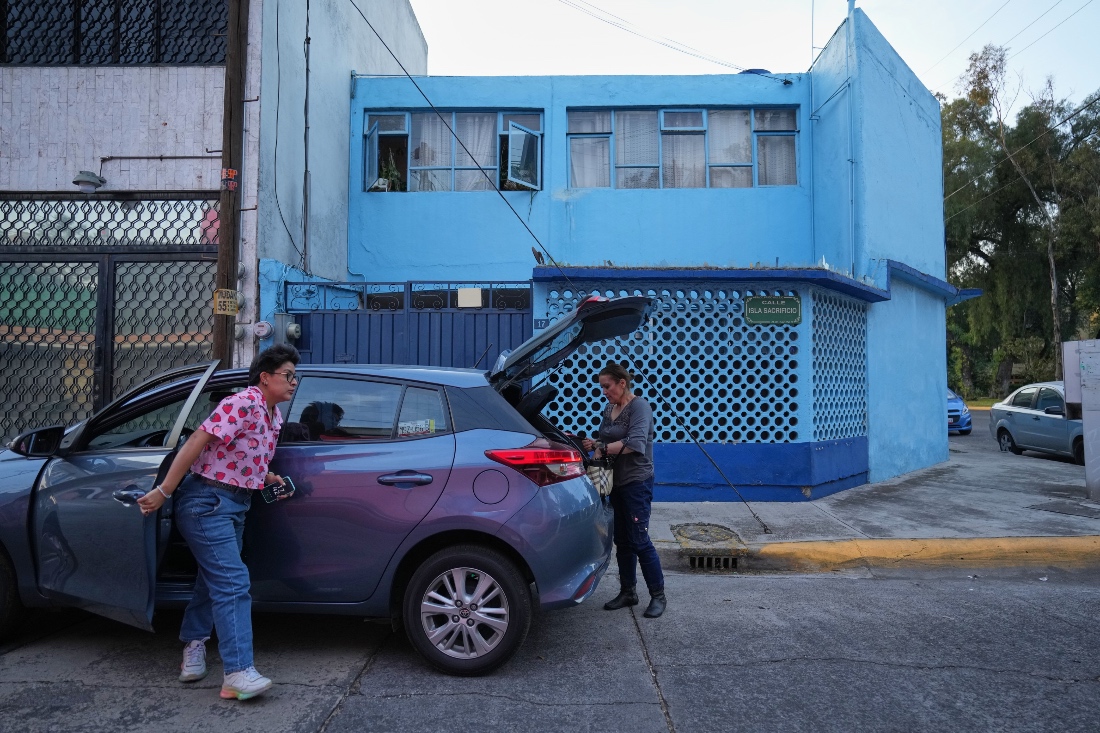 Diana Guzman, a driver with the feminist transportation collective AmorrAs, and passenger Ninfa Fuentes arrive at Fuentes' home in the State of Mexico. (AP)