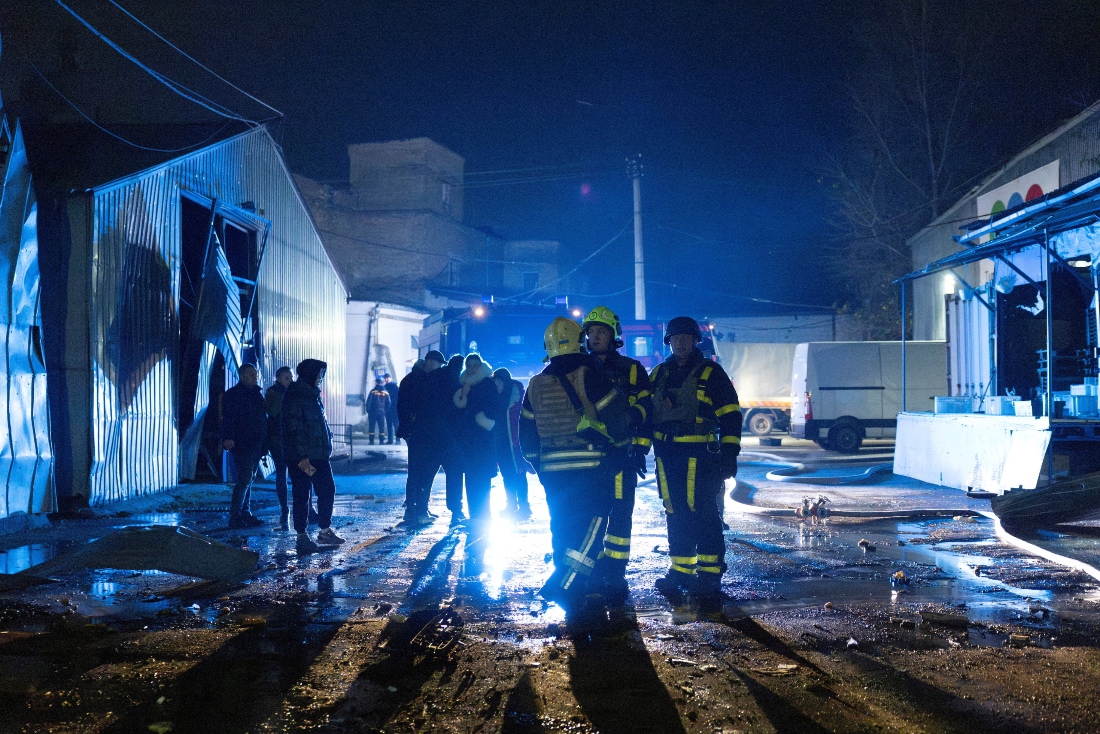 Firefighters stand at an impact site after a Russian drone attack, amid Russia's attack on Ukraine, in Kyiv, Ukraine. (Reuters)