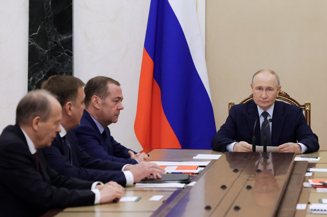 Russian President Vladimir Putin holds a meeting on issues related to the further build up of the Russian armed forces, as Federal Security Service (FSB) Director Alexander Bortnikov, Presidential Aide Alexei Dyumin and Deputy Chairman of the Security Council Dmitry Medvedev sit nearby, at the Kremlin in Moscow, Russia. (AP)