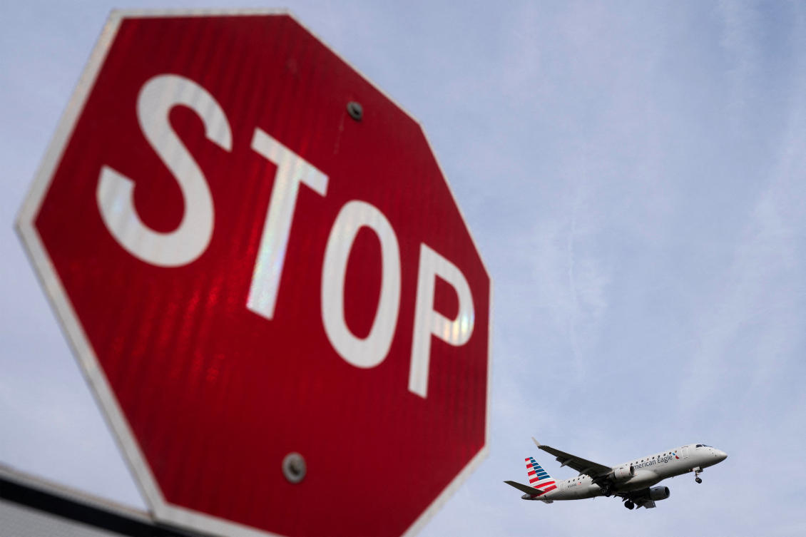 Above, an American Eagle flight lands at Ronald Reagan Washington National Airport. US airlines and travelers slogged through a second day of flight cuts across the country on Nov. 7, 2025. (Reuters)