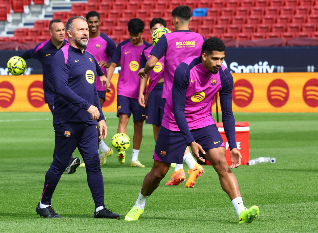 FC Barcelona coach Hansi Flick and Ronald Araujo during training after the reopening of Spotify Camp Nou FC Barcelona Training — Spotify Camp Nou, Barcelona, Nov. 7, 2025. (Reuters)