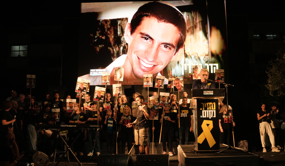 An image of Hadar Goldin, an Israeli soldier killed in 2014 whose body has been held in Gaza since then, is shown during a rally calling for the return of the deceased hostages who are held by Hamas in the Gaza Strip, in Tel Aviv, Israel, Saturday, Nov. 8, 2025. (AP)
