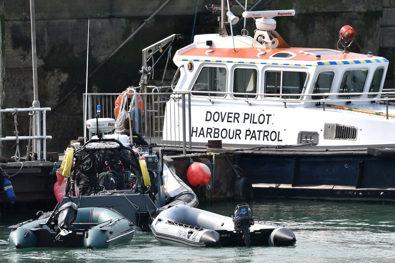Picture shows dinghy used by group of migrants to illegally cross the English Channel from France, as they are brought to shore by UK Border Force in the marina at Dover, on the south coast of England. (File/AFP)
