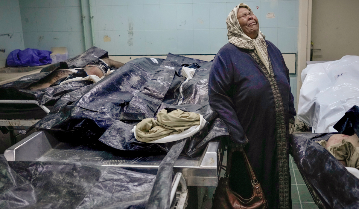 Hilala Meryeh, a 64-year-old Palestinian mother of four, weeps in the middle of the dingy identification room after finding her son's body at the Al-Mojtahed Hospital morgue in Damascus, Syria, on Wednesday, Dec. 11, 2024. (AP)