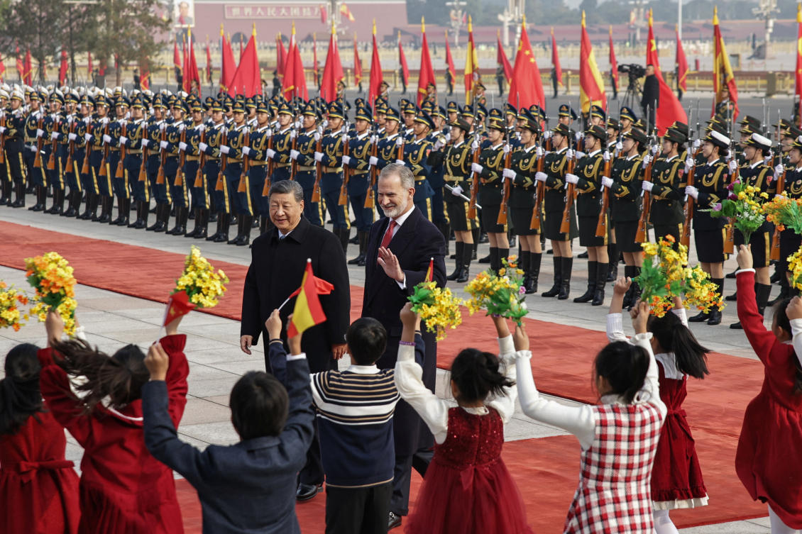 Spain’s King Felipe VI and Chinese President Xi Jinping walk during a welcome ceremony at the Great Hall of People in Beijing on Nov. 12, 2025. (Reuters)
