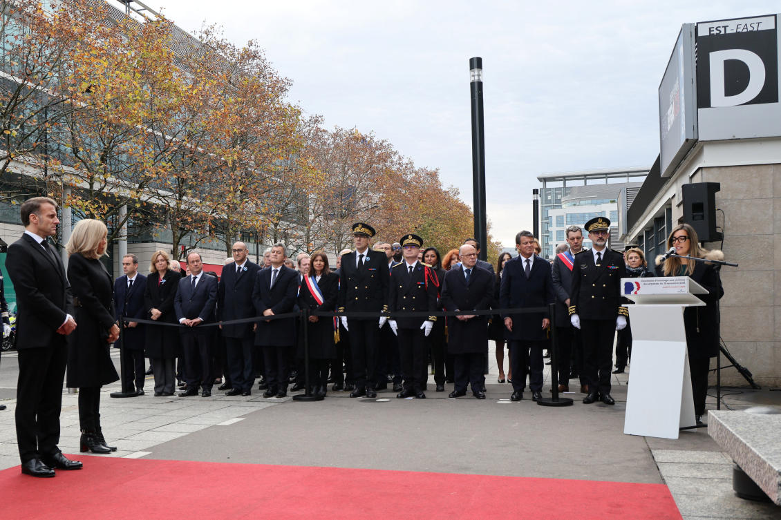 President of France Emmanuel Macron and his wife Brigitte Macron listen to Sophie Dias, daughter of Manuel Dias who died in the Stade de France stadium attack, deliver a speech during a ceremony paying tribute to victims outside the Stade de France stadium in Saint-Denis on Nov. 13, 2025. (Reuters)