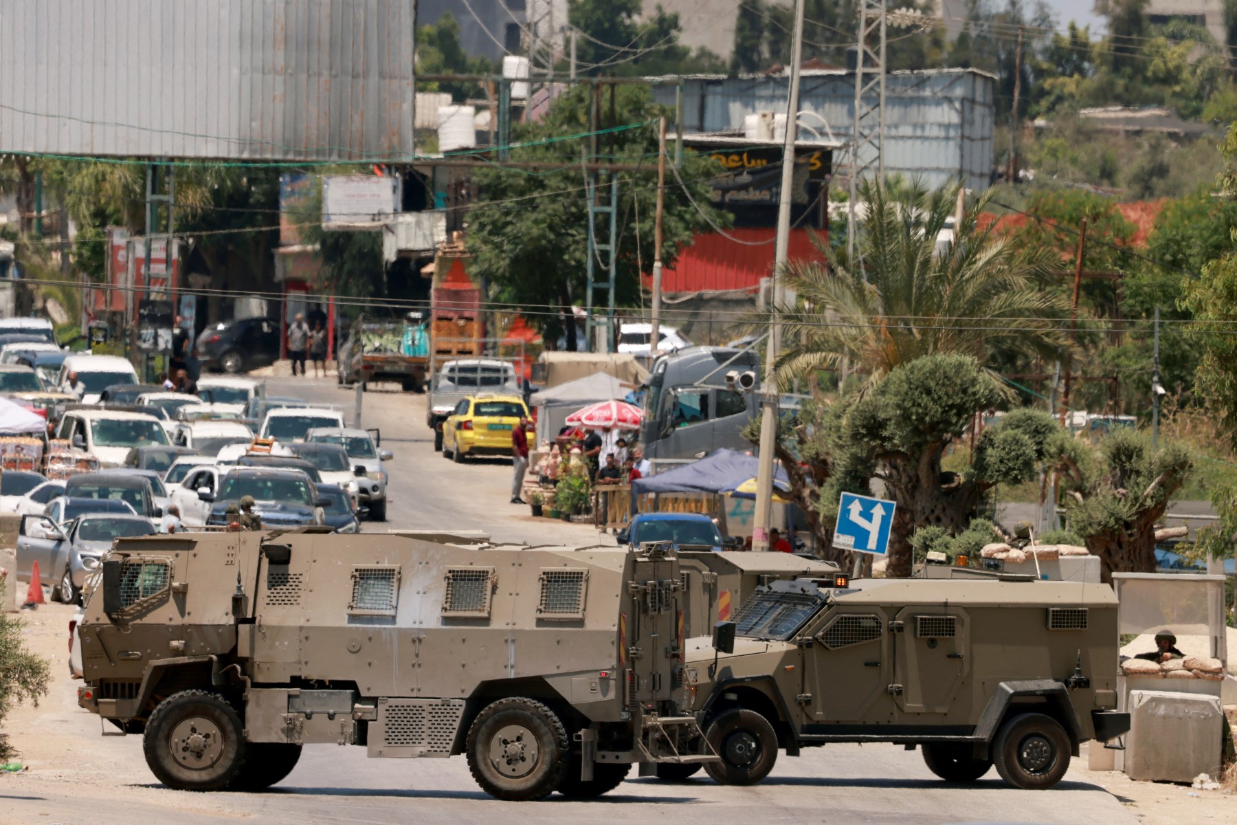 Israeli army vehicles close off the entrance to the West Bank city of Qalqilya. (File / AFP)