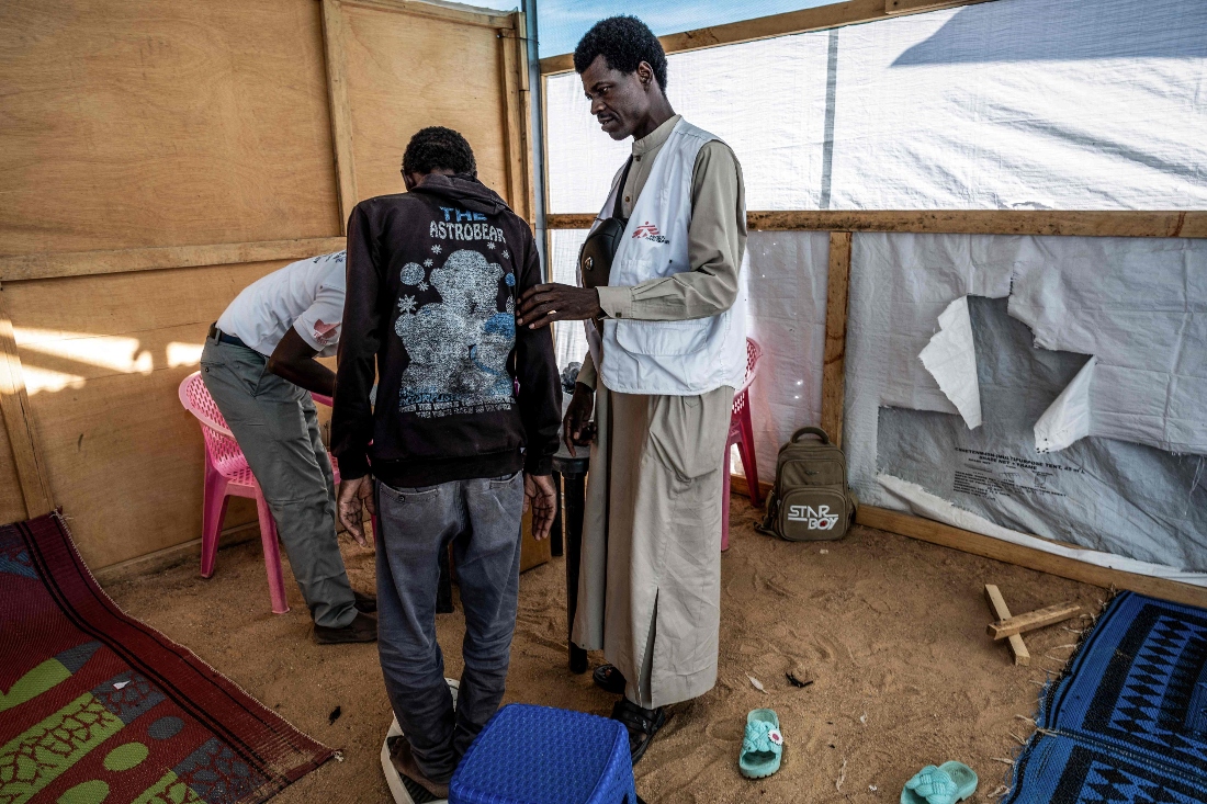 A patient from Sudan undergoes an examination at the Doctors Without Borders (MSF) clinic in the Tine transit camp in Chad. (AFP)
