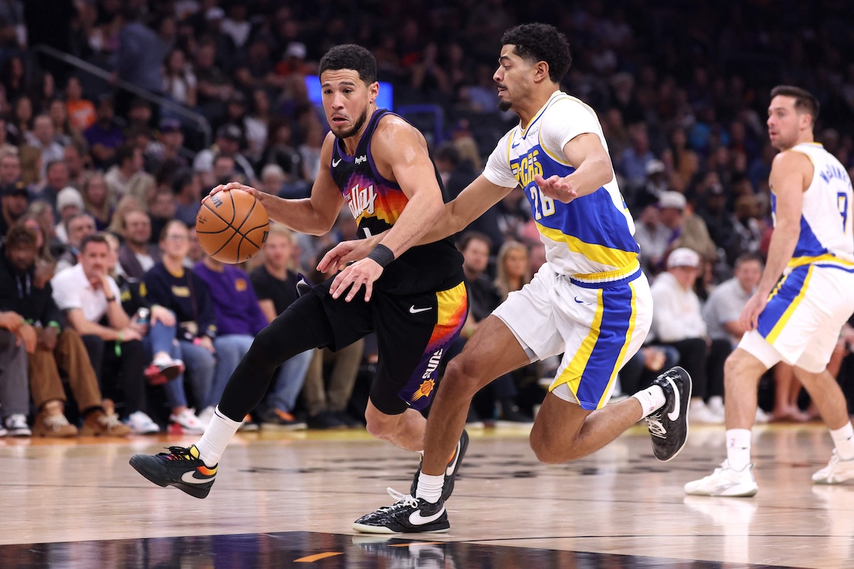 Devin Booker of the Phoenix Suns drives to the basket against Ben Sheppard of the Indiana Pacers during the first half of an NBA game at Mortgage Matchup Center on Thursday in Phoenix, Arizona. (Getty Images via AFP)