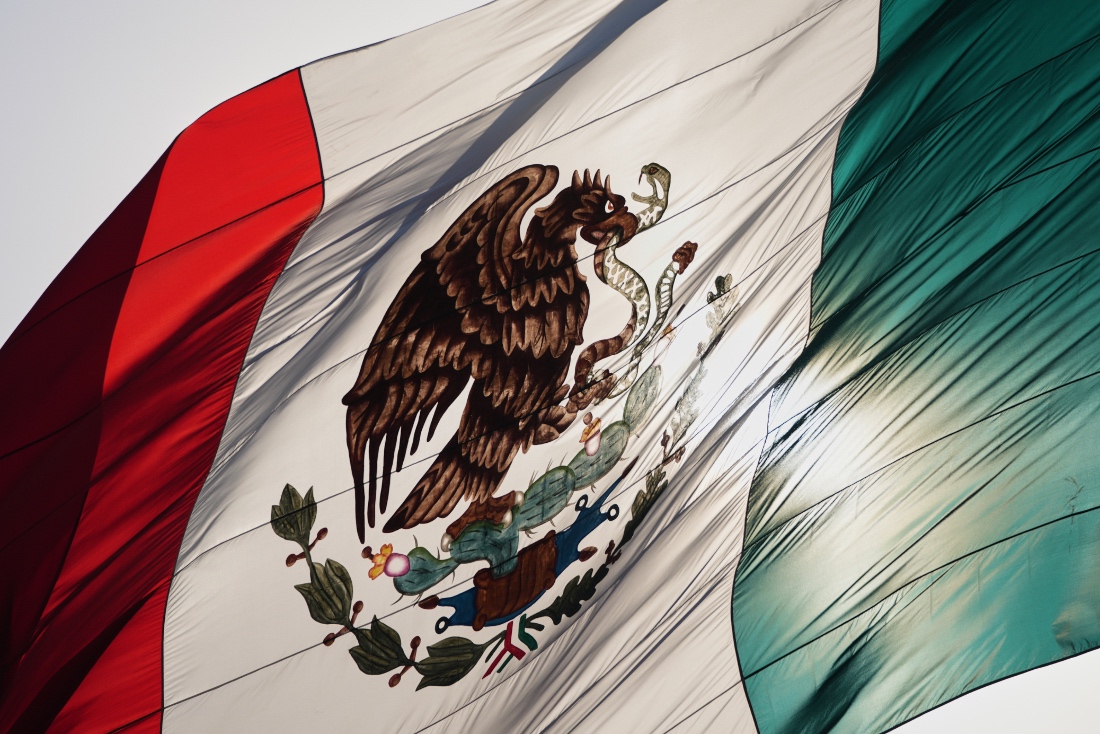 Mexico's coat of arms decorates a large flag in the city's Zocalo square, Mexico City. (AP)
