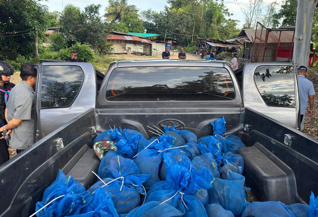 Above, macaques in blue mesh bags after being rescued from a wildlife smuggling operation in Aranyaprathet district in Sa Kaeo province near the Thailand-Cambodia border. (12th Ranger Forces Regiment of the Royal Thai Army/AFP)