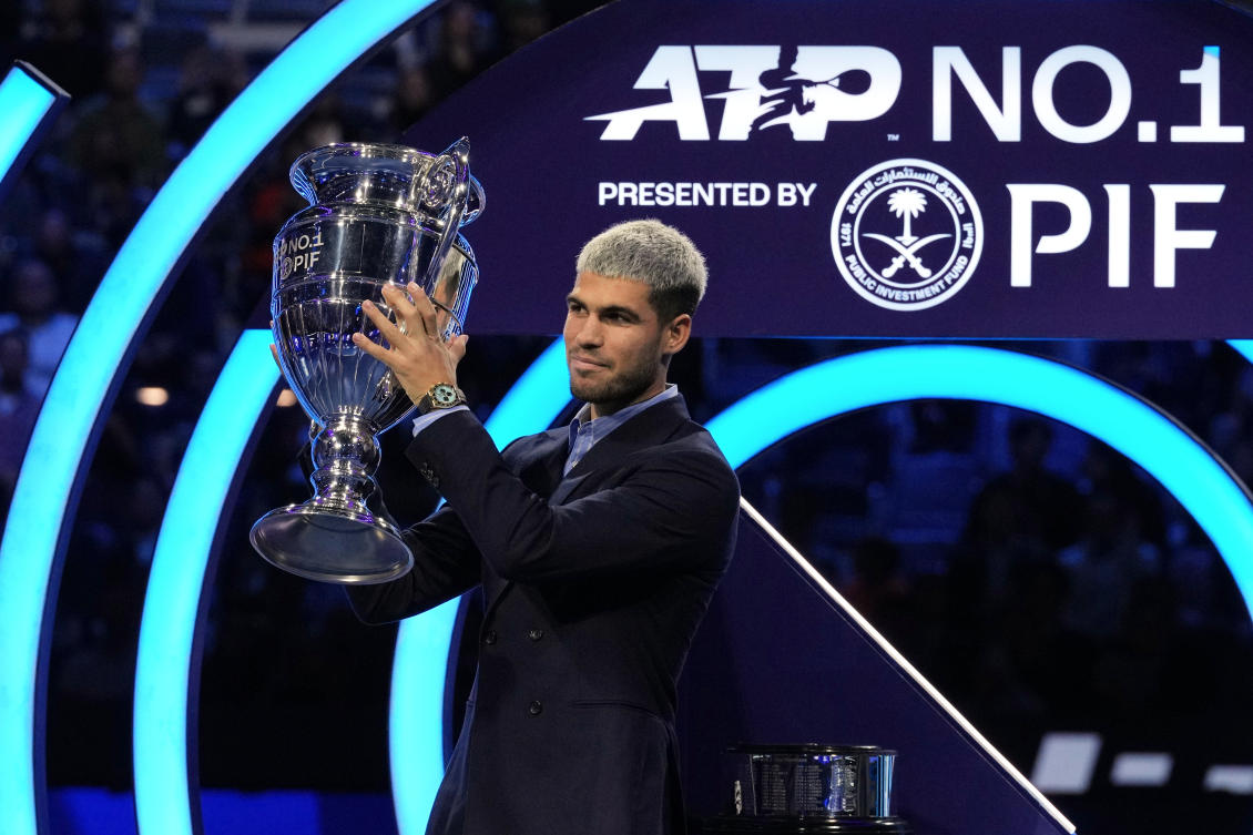 Spain’s Carlos Alcaraz holds the trophy for finishing the year ranked No. 1 as ATP world best player during the ATP World Tour Finals, in Turin, Italy on Nov. 14, 2025. (AP)