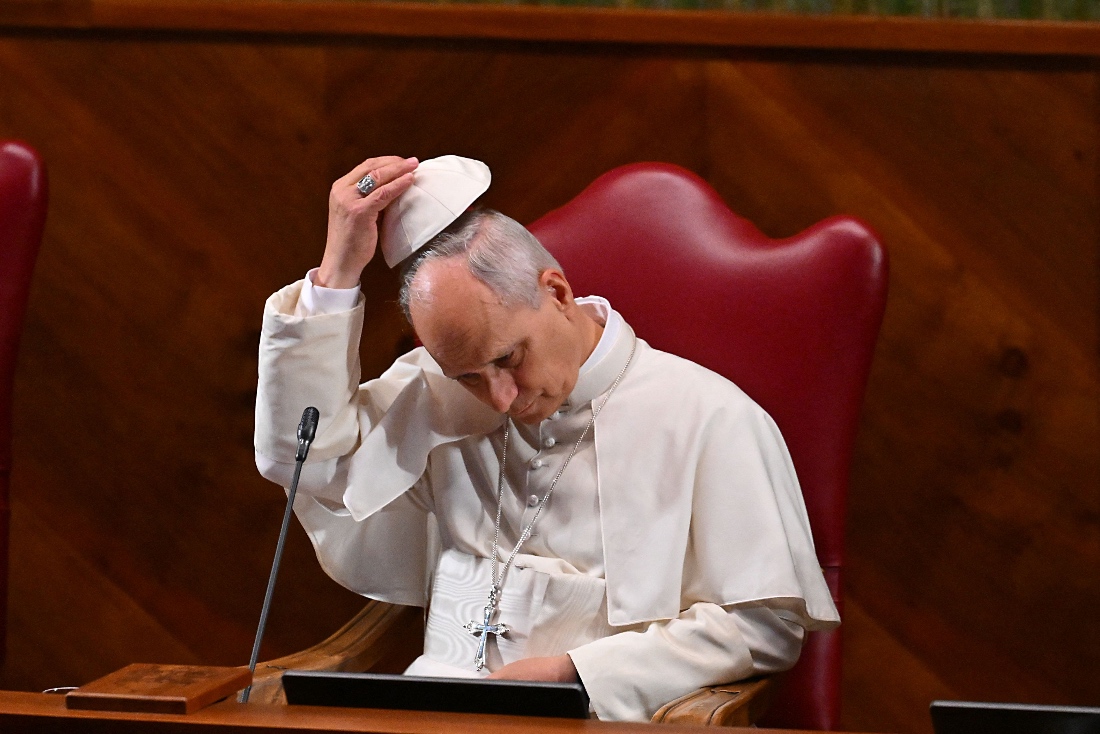 Pope Leo XIV adjusts his skullcap during the opening of Dies Academicus, the official inauguration of the 2025-2026 Academic Year at the Aula Magna of the Pontifical Lateran University in Rome, Italy. (AFP)