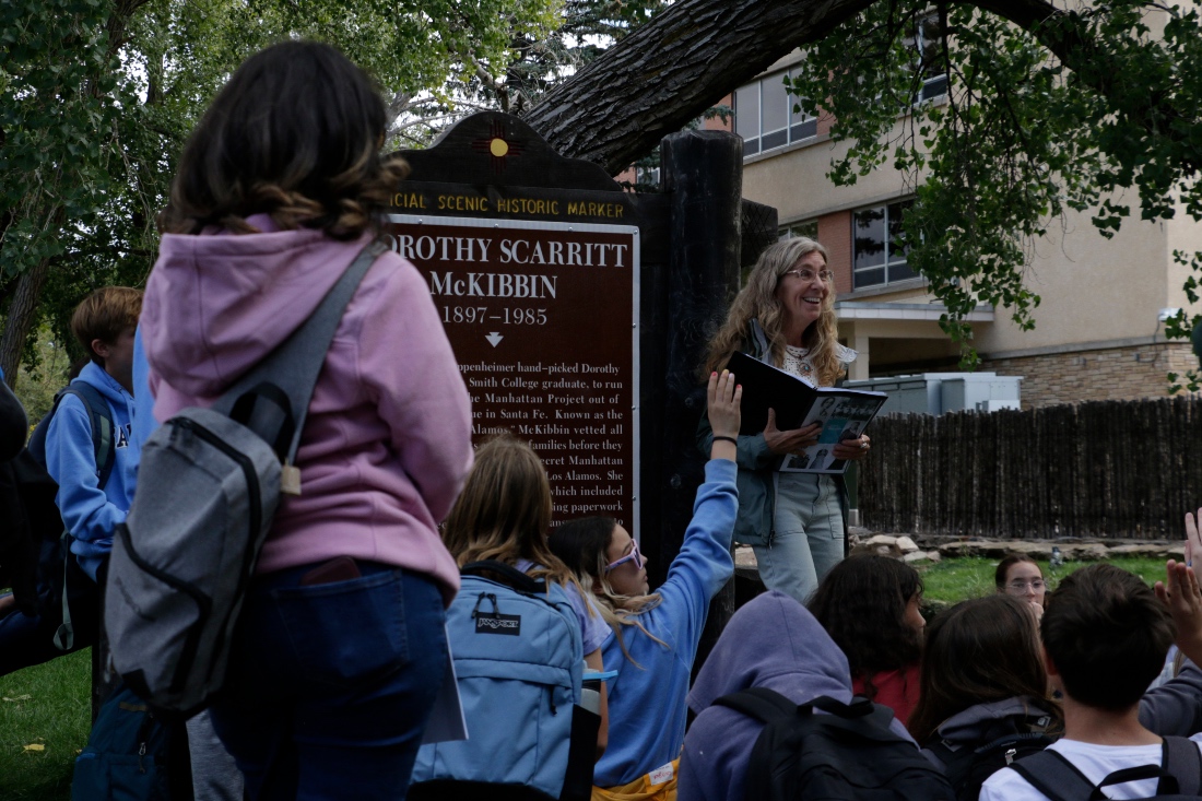 Lisa Nordstrum, a history teacher at Santa Fe Preparatory School, leads a discussion about a historical marker with her seventh-grade history class during a field trip in Sante Fe, US. (AP)