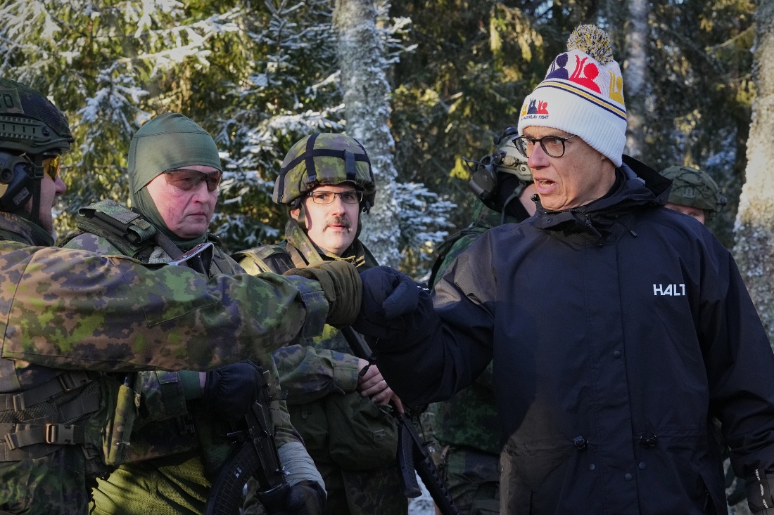 Finland's President Alexander Stubb greets volunteers during a combat rescue exercises organized by the National Defence Training Association of Finland, in Halvala, Finland. (AP)