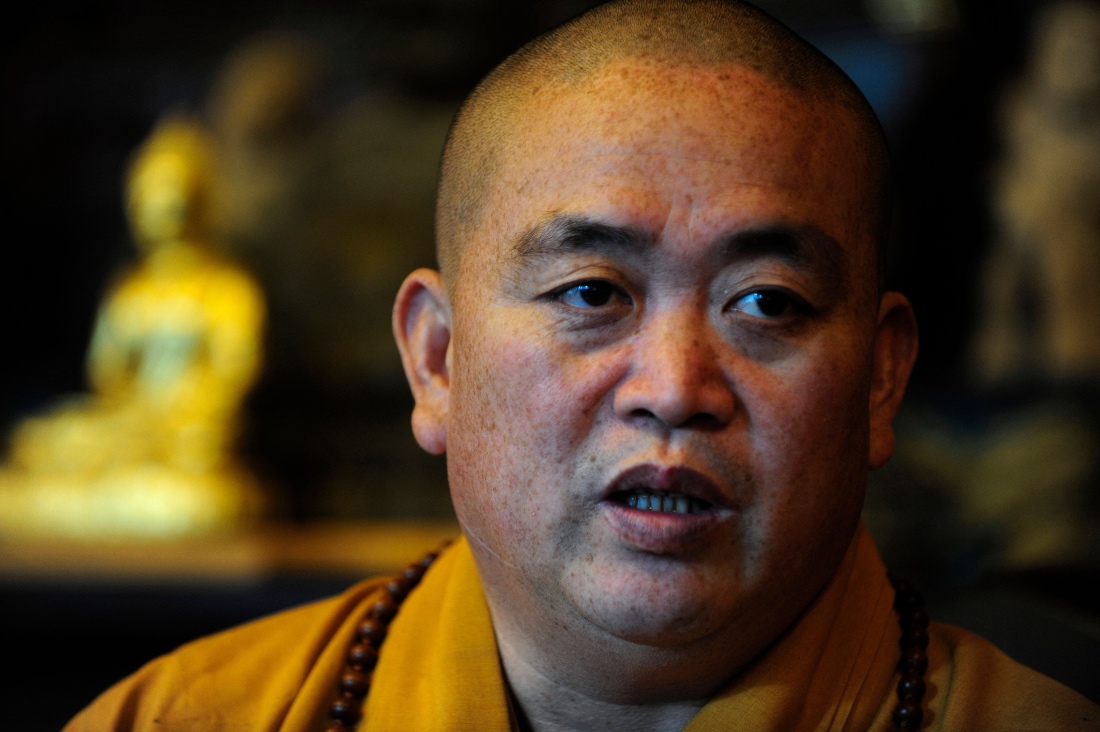 The abbot of Shaolin Temple, Shi Yongxin, speaking to AFP at the famous temple in Henan province. (AFP)