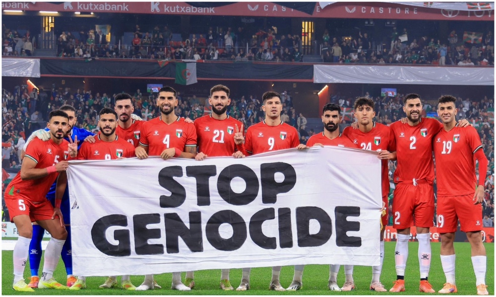The Palestinian players held a banner before the match that read “Stop Genocide”. (Wafa)