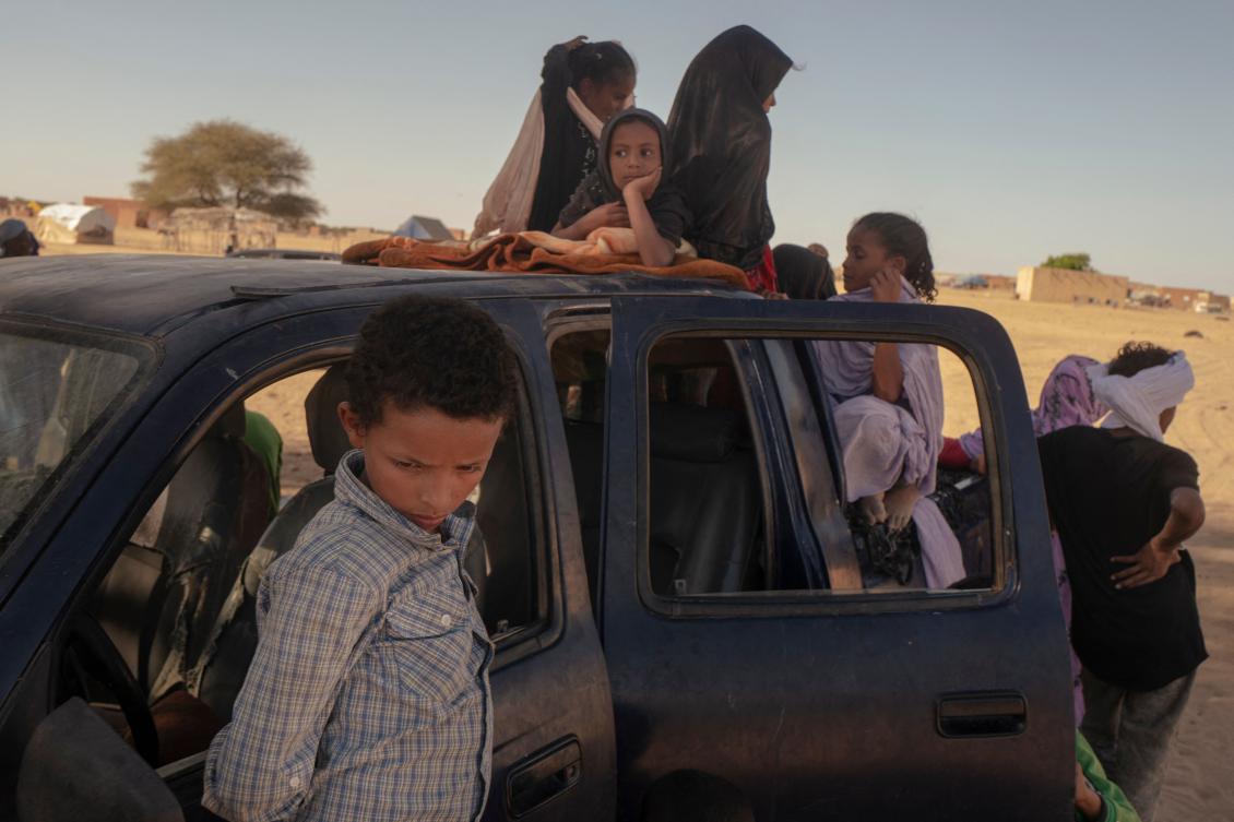 Malian families fleeing Group for Support of Islam and Muslims (JNIM) militants from the town of Lere, cross into Mauritania at the Douankara border point in Fassale on Nov. 4, 2025. (AFP)