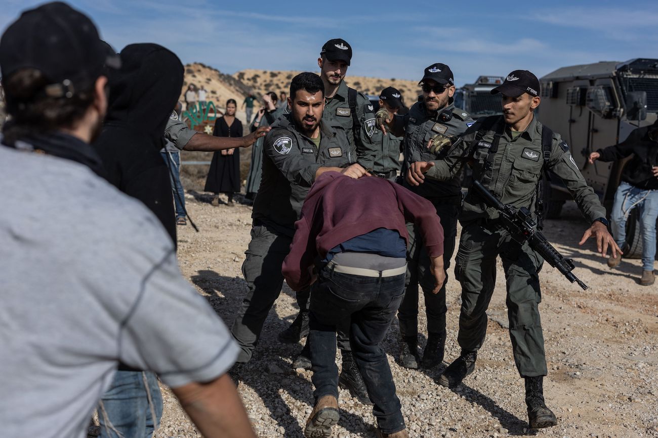 Israeli security forces clash with Hilltop Youth as they evacuate and demolish an illegal outpost built near the Jewish settlement of Metzad east of the Palestinian city of Sa’ir in occupied West Bank, on Nov. 17, 2025. (AFP)