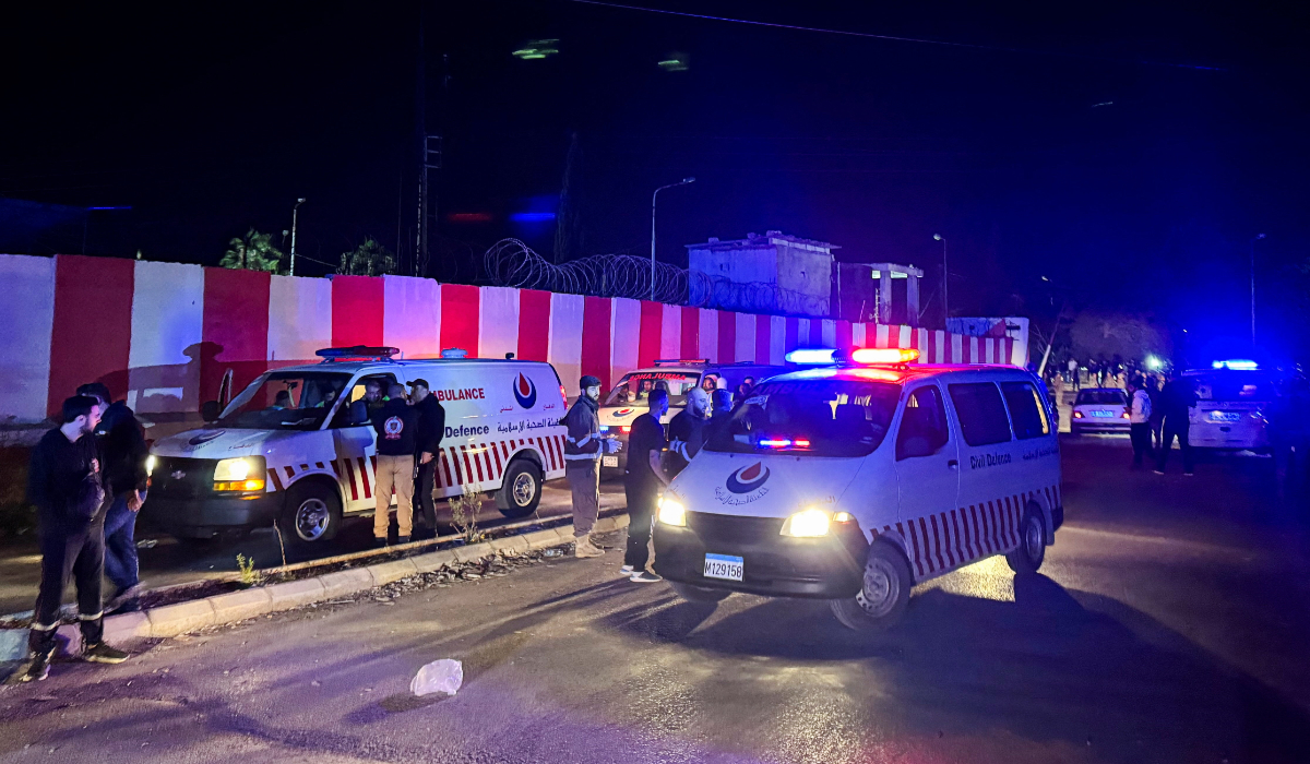 Civil defence vehicles park at the entrance of Ain al-Hilweh Palestinian refugee camp, following an Israeli strike that killed several people, according to the Lebanese Health Ministry, in the southern city of Sidon, Lebanon November 18, 2025. (REUTERS)