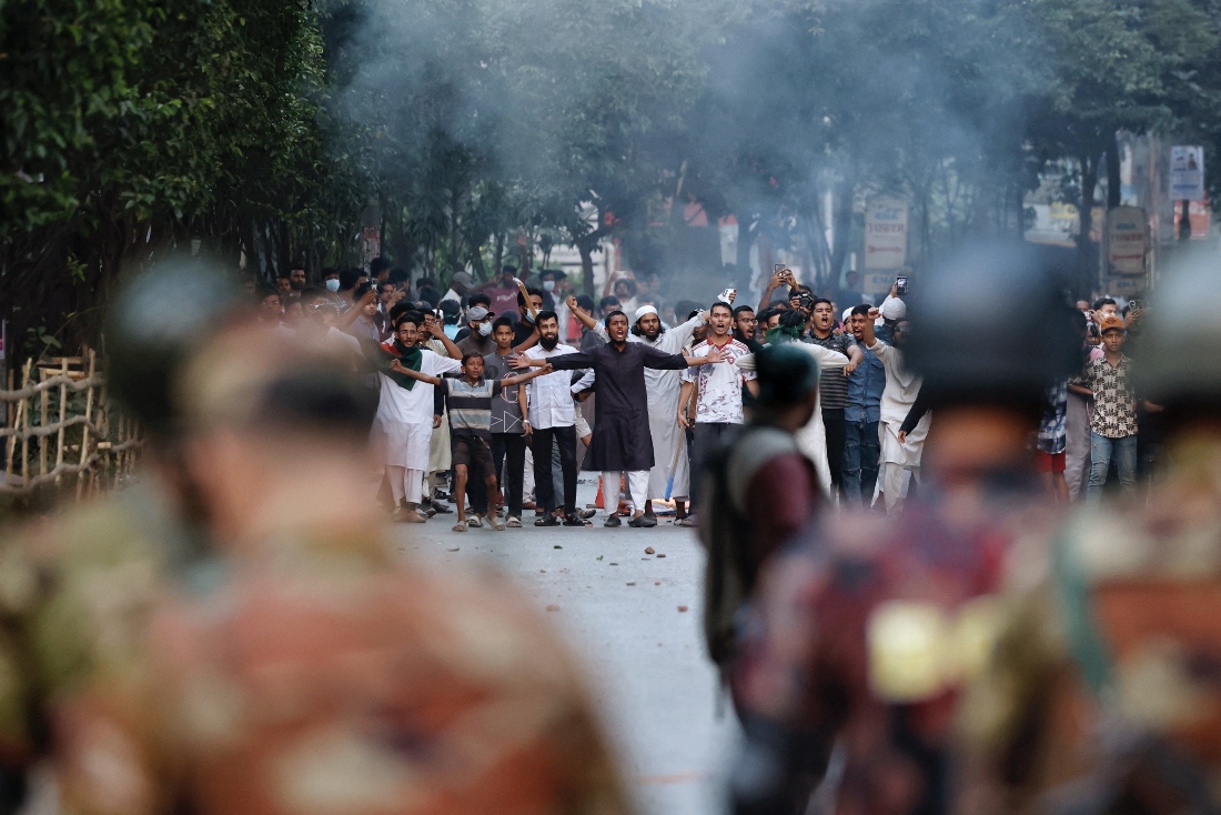 Anti-Hasina demonstrators engage in a clash with security forces after the verdict on cases against the ousted Prime Minister Sheikh Hasina in Dhaka, Bangladesh. (Reuters)