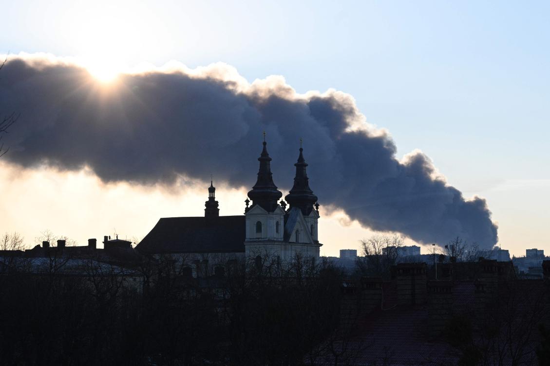 Smoke rises above buildings following a mass overnight Russian drone and missile attacks, in the western Ukrainian city of Lviv on November 19, 2025, amid the Russian invasion of Ukraine. (AFP)