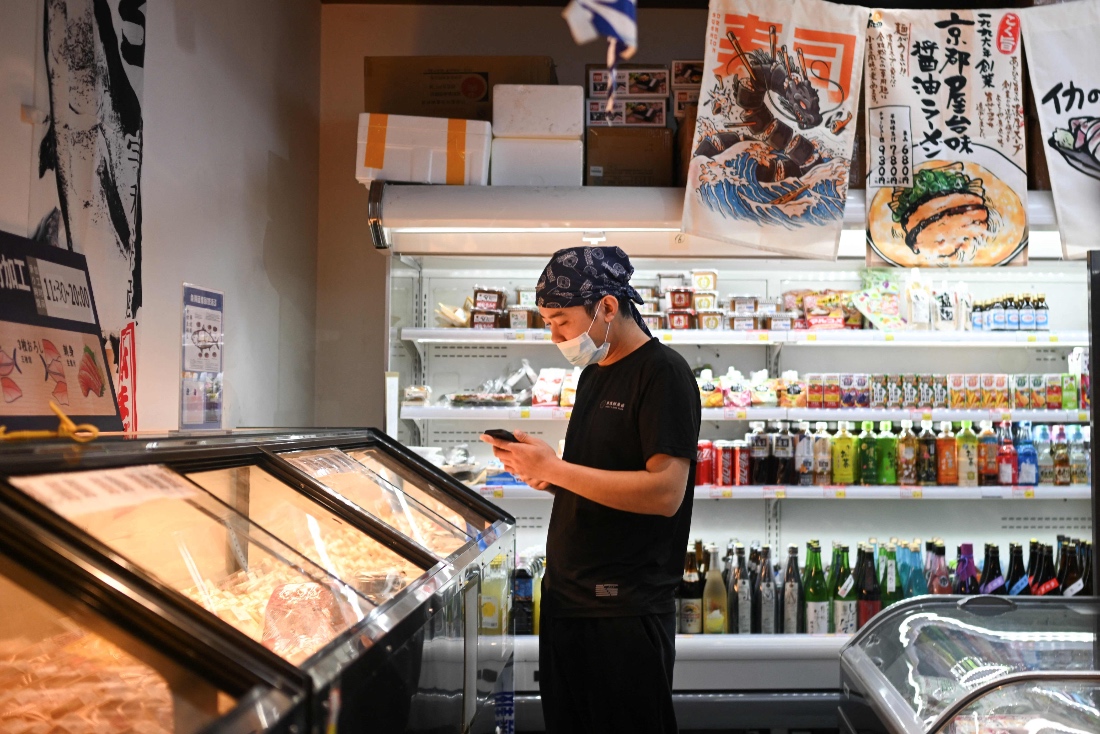 A worker is seen in a Japanese products supermarket in Beijing, China. (AFP)