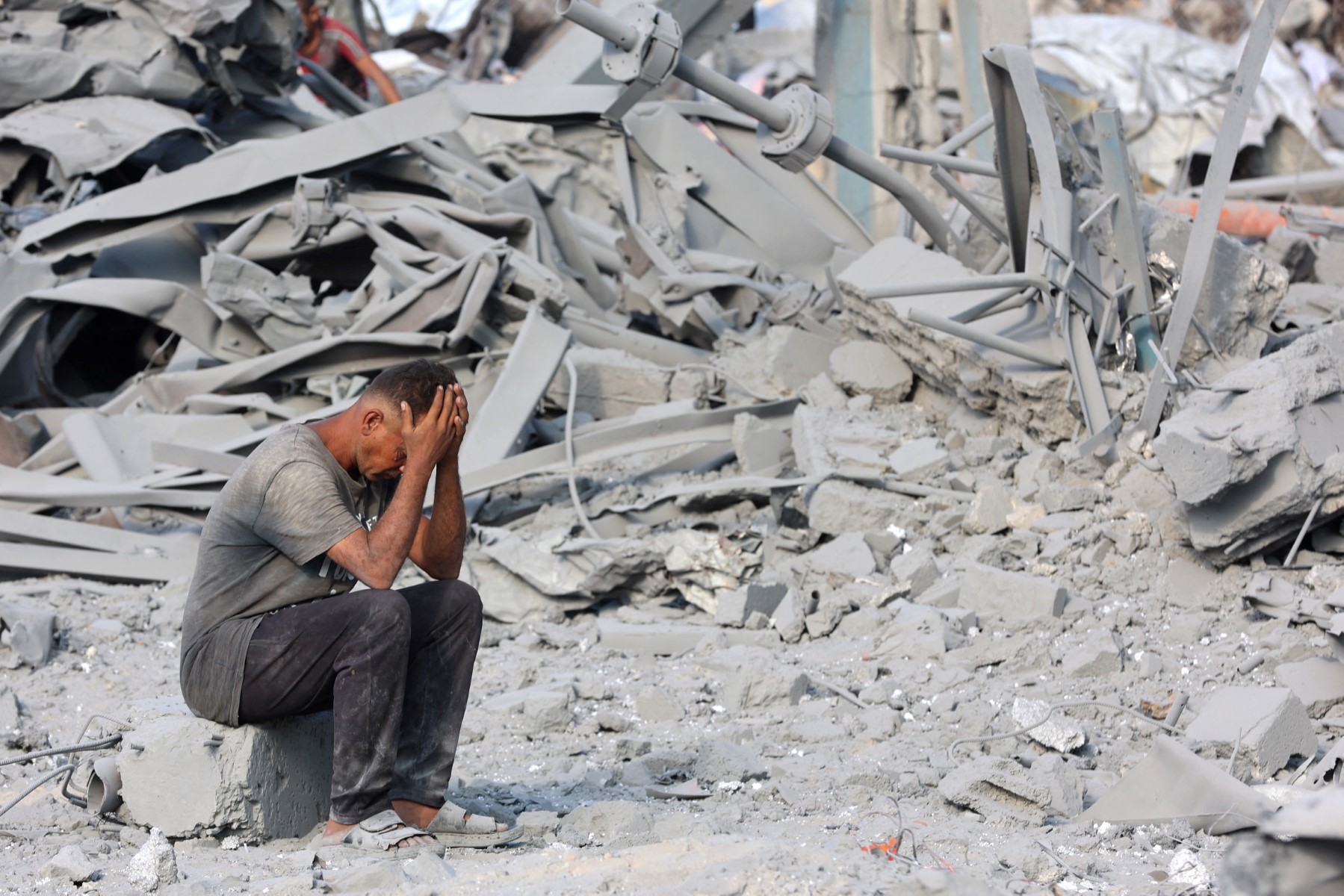 A Palestinian man reacts to the destruction after an overnight strike on the Sheikh Radwan Health Centre run by the UN Relief and Works Agency for Palestine Refugees (UNRWA) in the north of Gaza City, Aug. 6, 2025. (AFP)